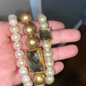 Stacking pearl bracelets.